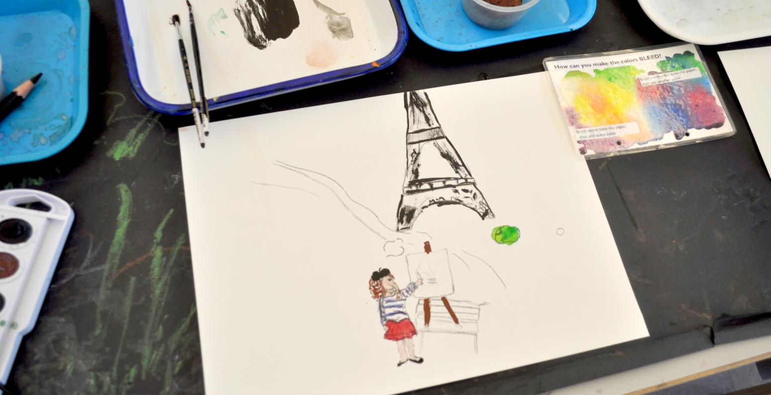 A watercolor painting of a girl painting in front of the Eiffel Tower.