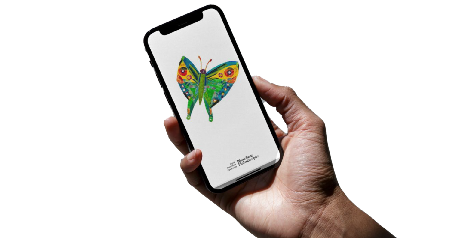 hand holding phone with Eric Carle butterfly on screen