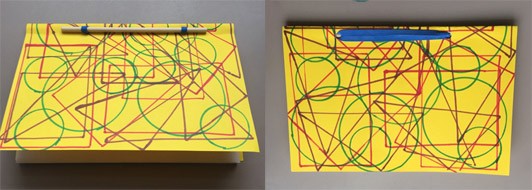Two pictures: One showing the front of a book bound with a stick and rubber band with a bright yellow cover with bold traced shapes. The second image shows the back of the book, (which has the same patterned back cover) where more of the rubber band is seen.