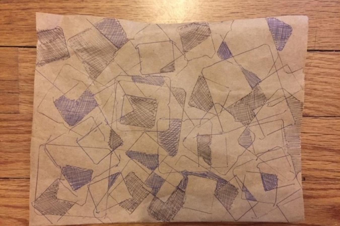 Tracings from rectangle and square objects, on brown paper where some sections are filled in with pen marks.