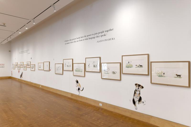 Installation image showing walls with framed art.