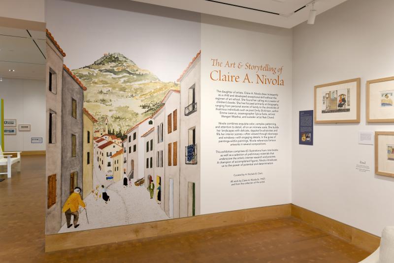 Photograph of gallery showing framed art and graphics.