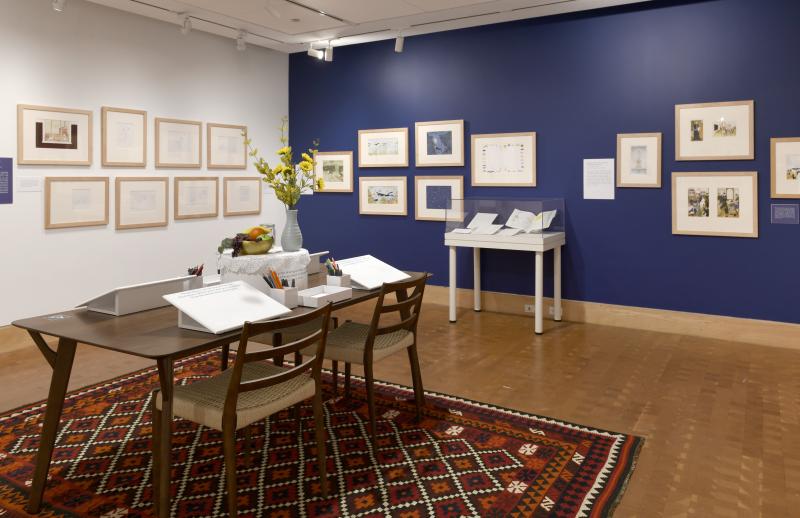 Photograph of gallery showing framed art and graphics.