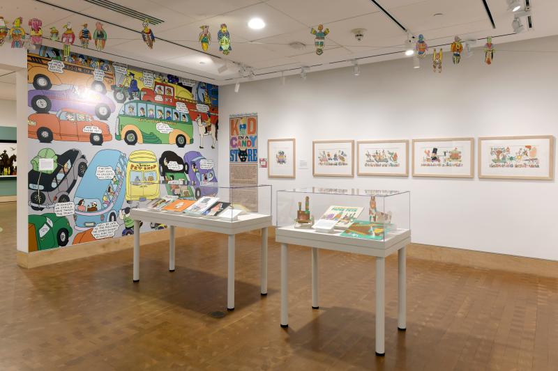 Photograph of gallery showing framed art and graphics.