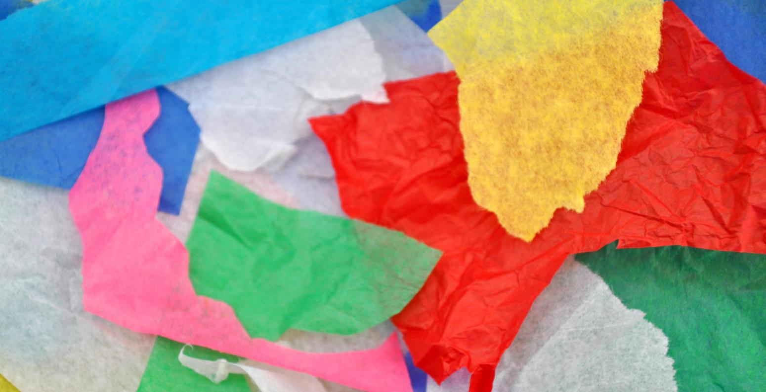 A collection of colorful, cut & torn tissue paper scraps.