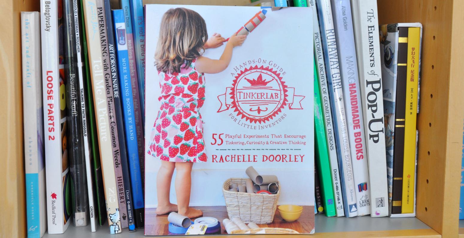 A copy of the book "Tinkerlab" sitting on a bookshelf.