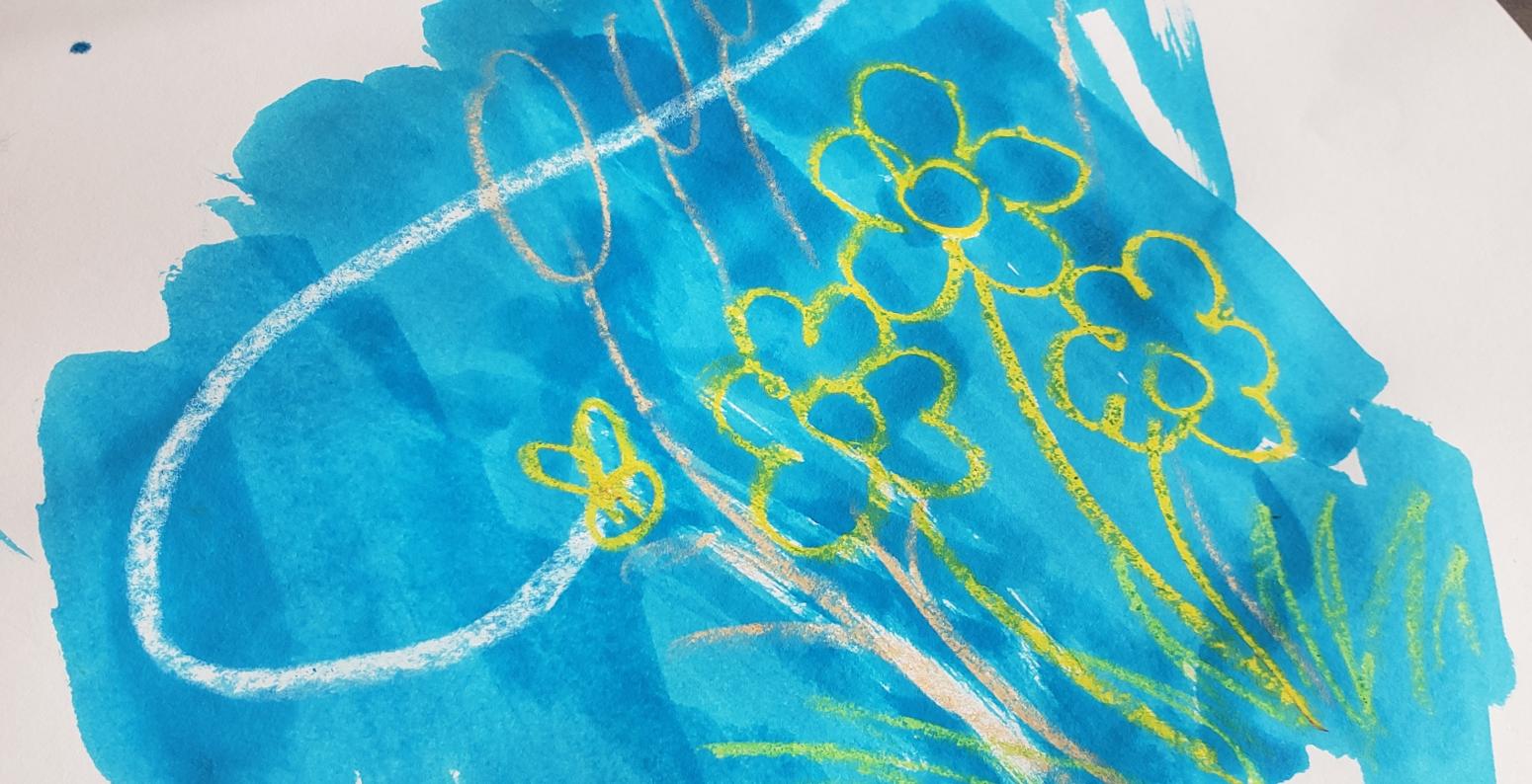 A watercolor resist drawing of white and yellow flowers with a blue background.