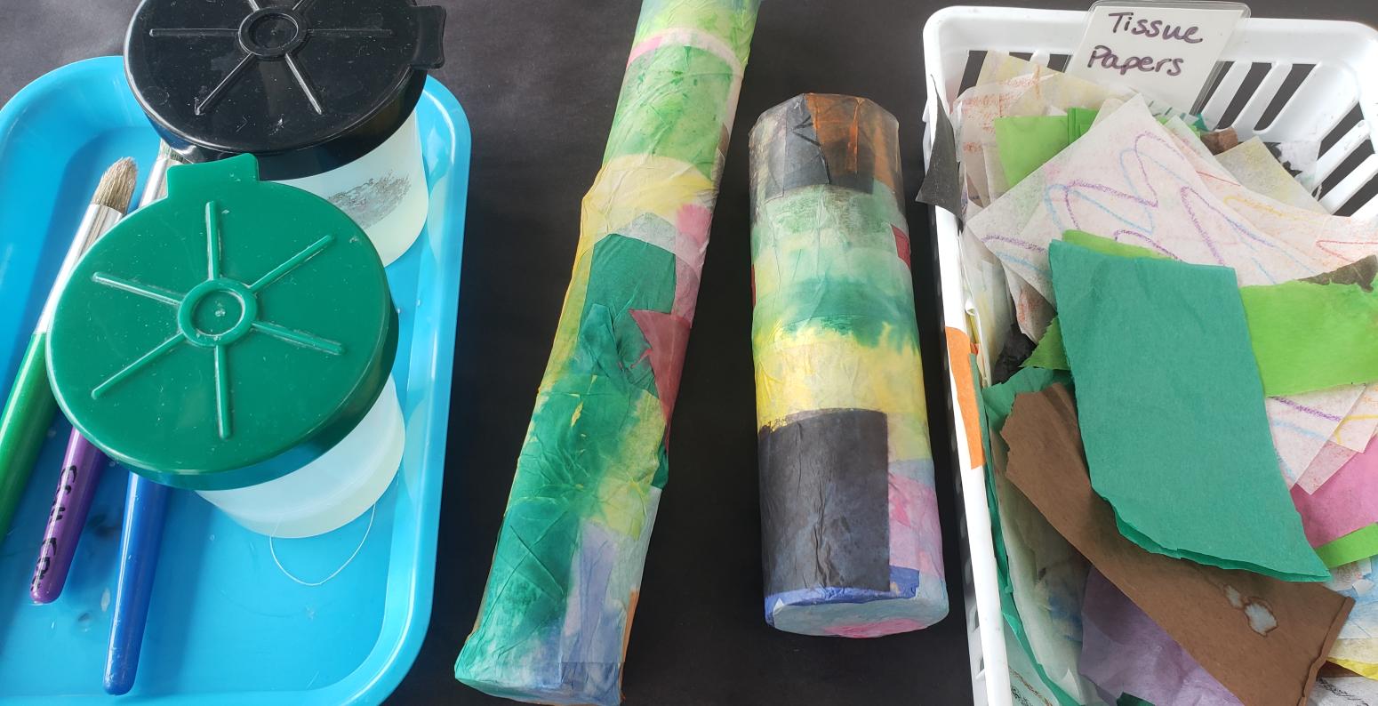 20220414_091421.jpg Glue cups, two noisemakers, and a basket of tissue papers.