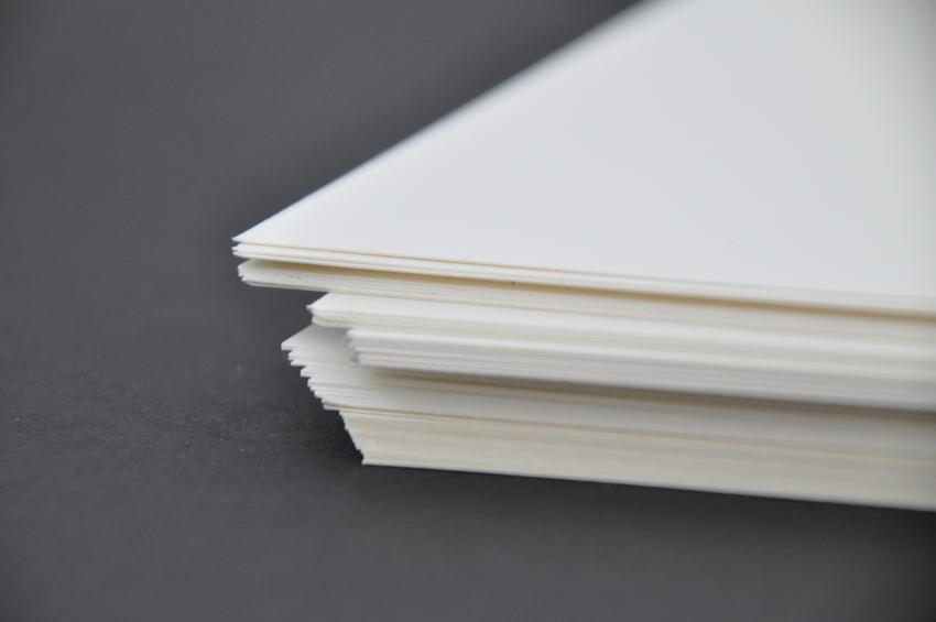 A stack of white watercolor paper. 