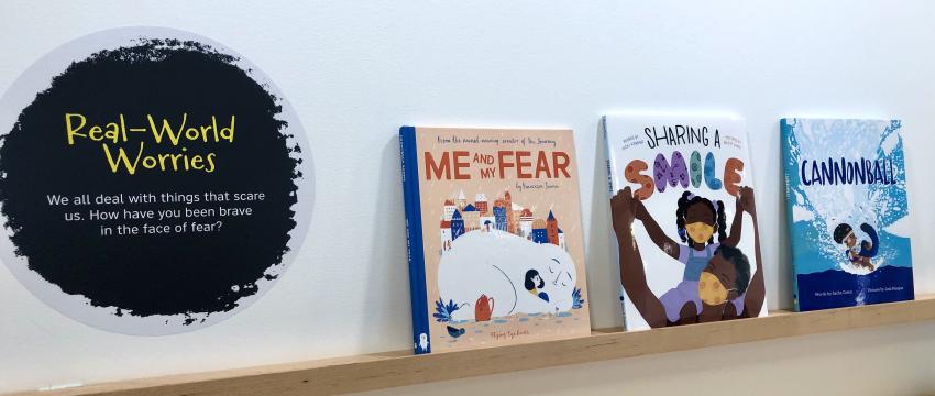 Ledge of books in Facing Fears exhibition