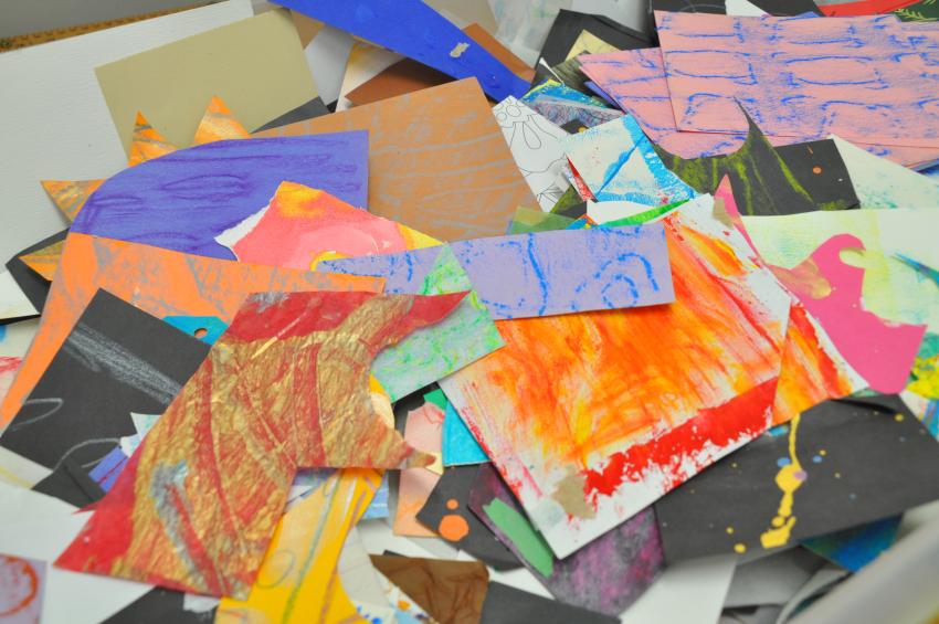 A pile of assorted painted and textured papers. 