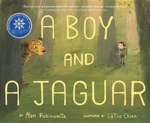 A boy and a jaguar peer at each other from behind trees in a forest. 