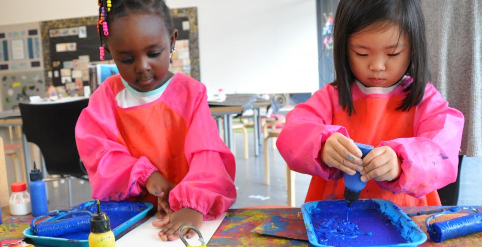 Two children printing with paints in the Art Studio
