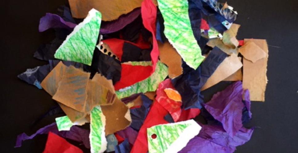 Pile of torn collage papers in various colors and textures