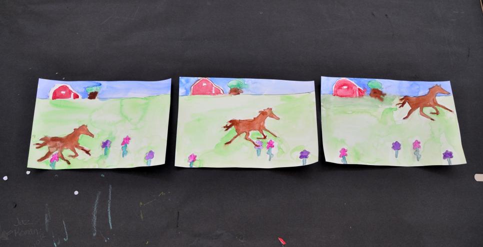 The paintings with a horse running across a field.
