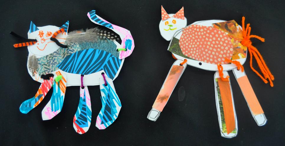 Two cat puppets made form collage materials, yarn, and pipe cleaners.