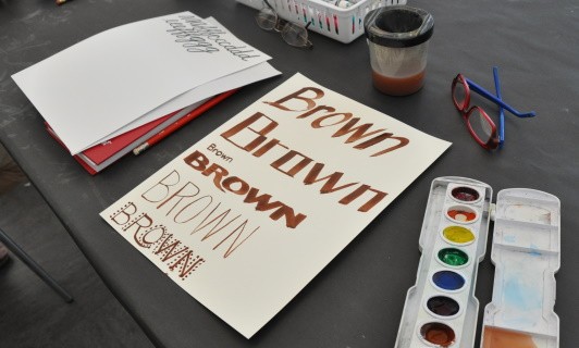 A paper covered in the word "brown" where each word is done in a different style, some with small letters, others bold, some with only straight lines, some with narrow lines.