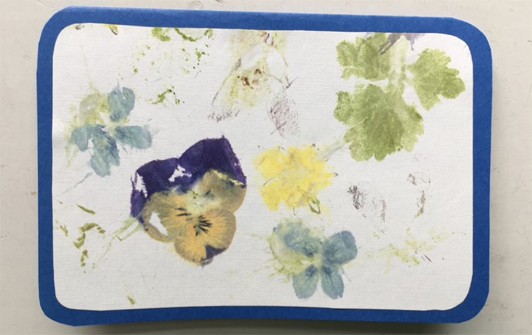 A blue card with the wildflower-printed paper glued to the front.