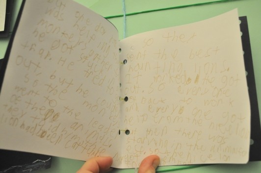 A close-up of the inside of Emmett’s book with is filled with words.