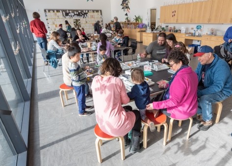 A full Art Studio with guests of all ages making art.